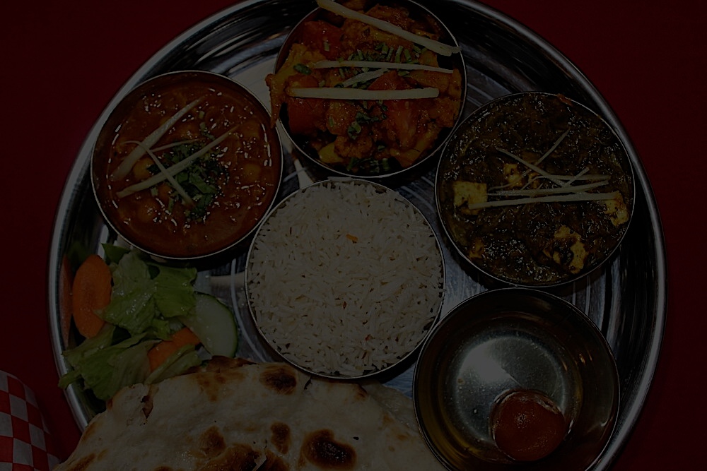 delicious vegetarian thali with naan bread