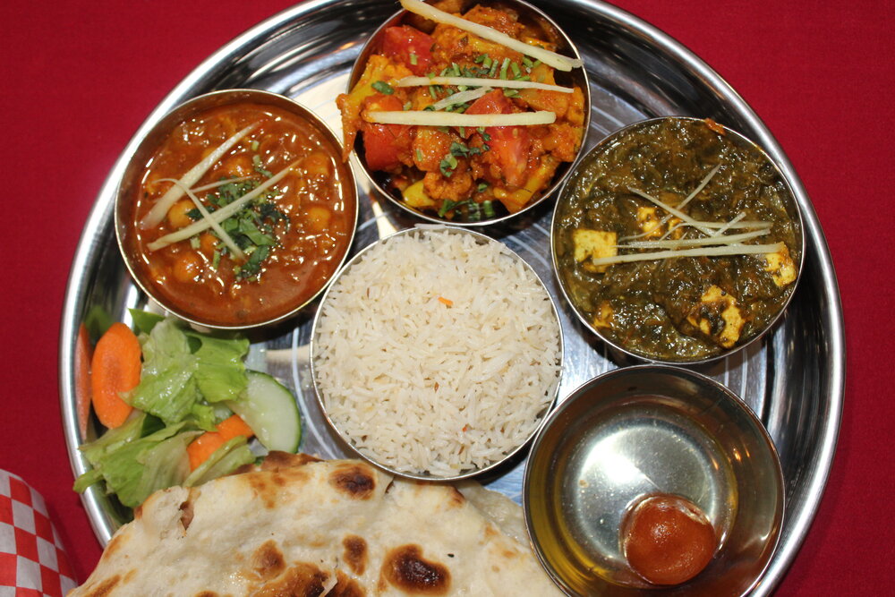 Vegetarian thali with naan bread